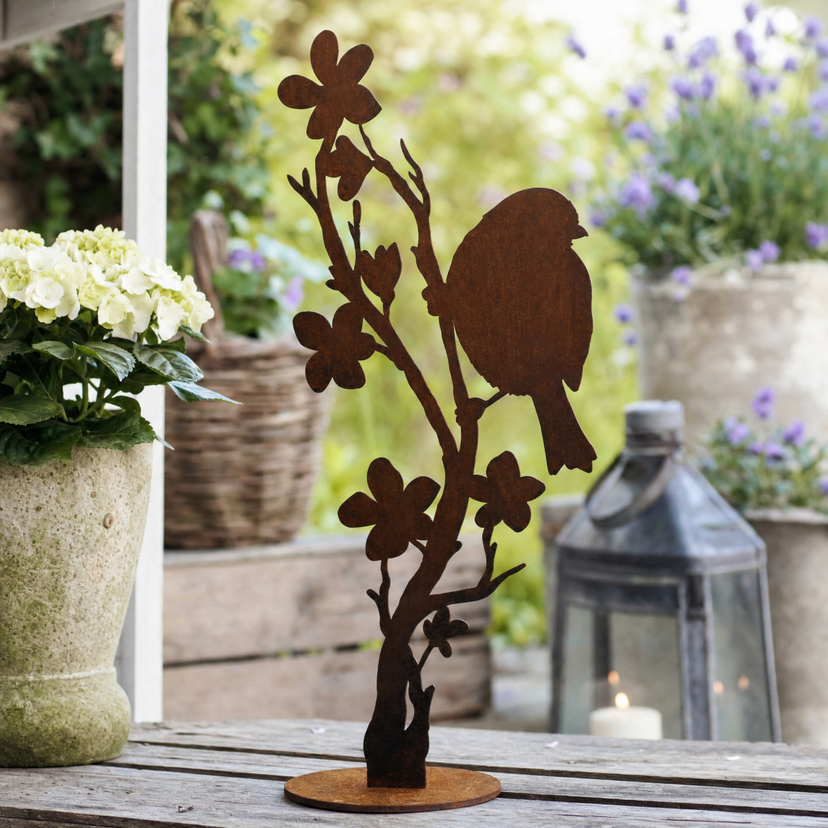 Danas jernfigur - Fugl på blomstergren